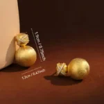 Boucles d’oreilles dorées – Perles satinées & touche brillante
